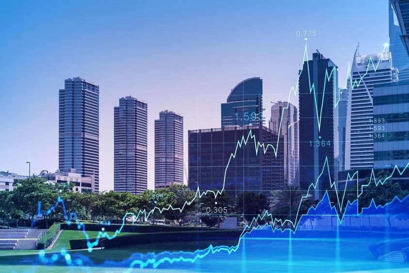 Dubai panoráma, előtérben a tőzsdei emelkedés diagrammal.