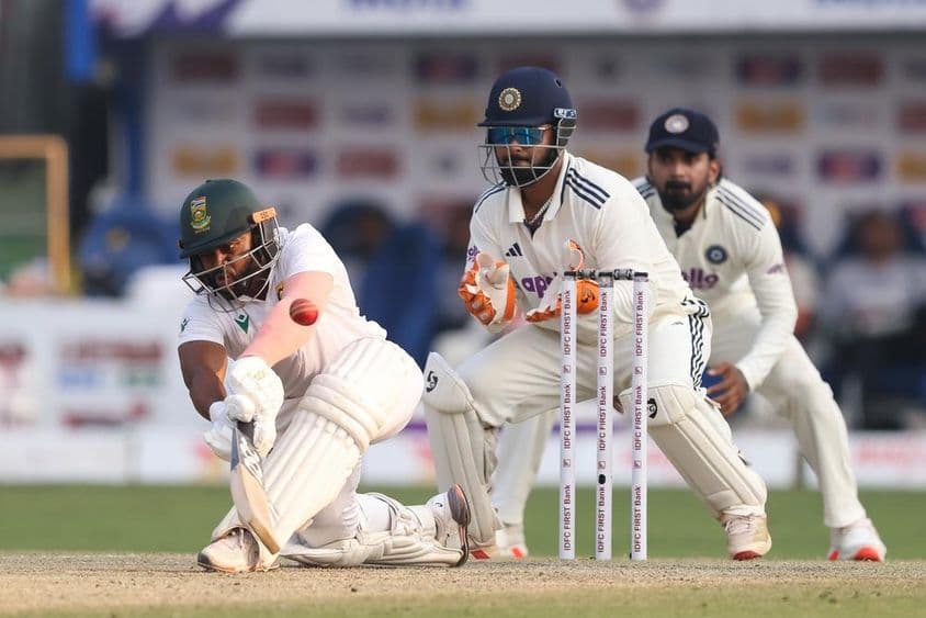 Krikett játékosok a pályán.